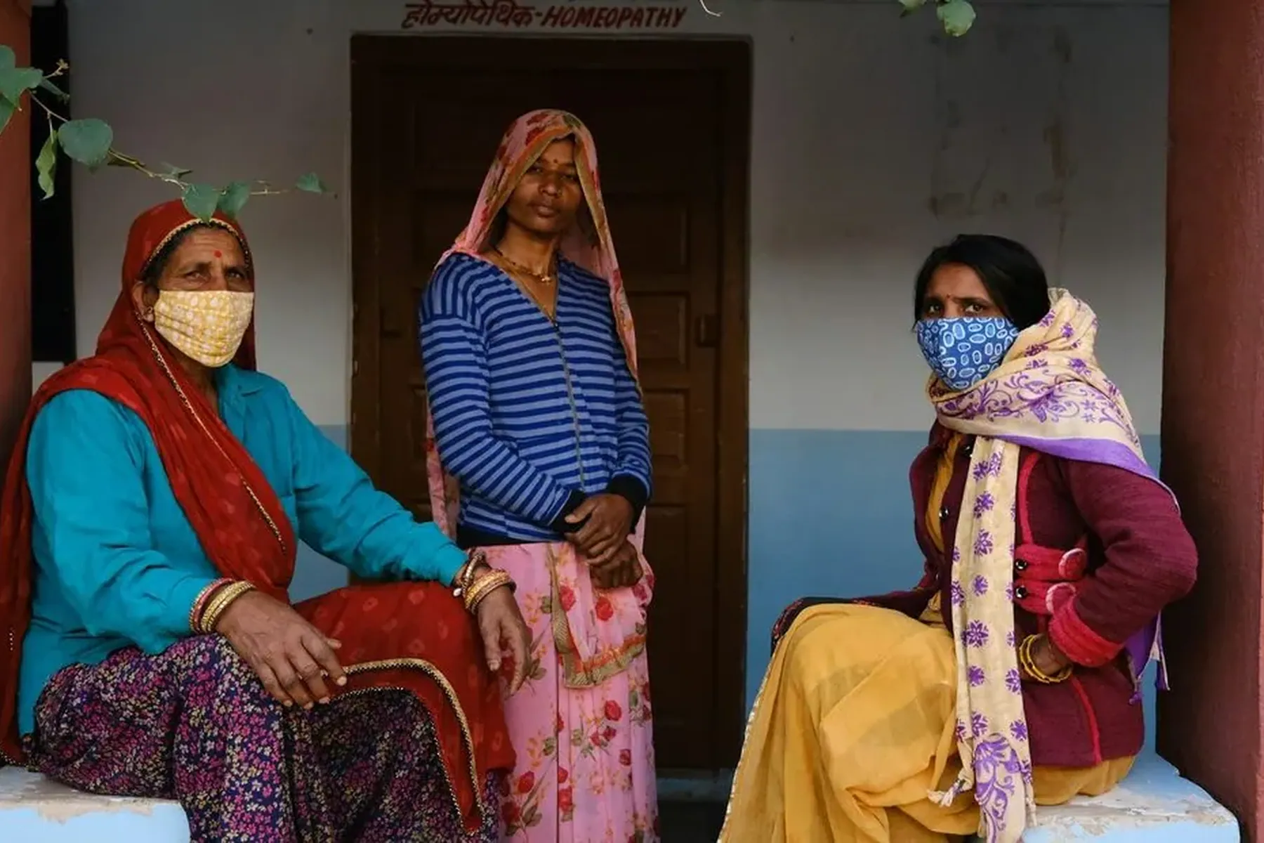 Three women in a doorway