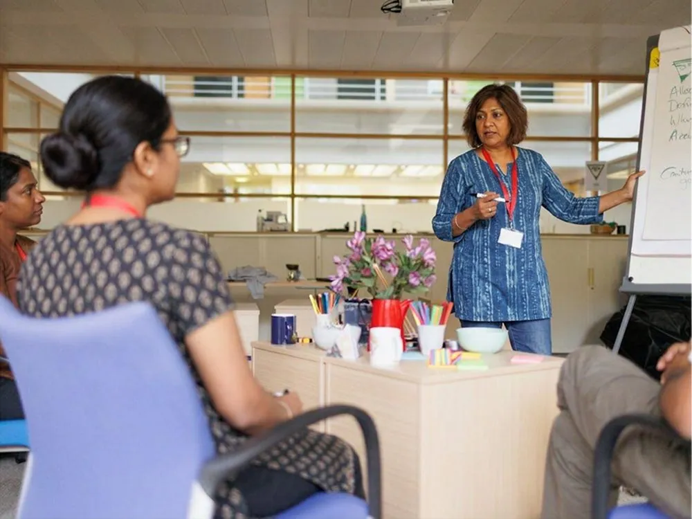 A woman presenting to a small group