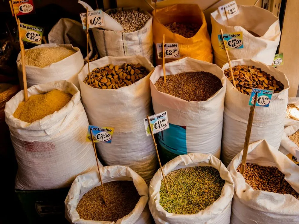 Open sacks of pulses and spices at a market