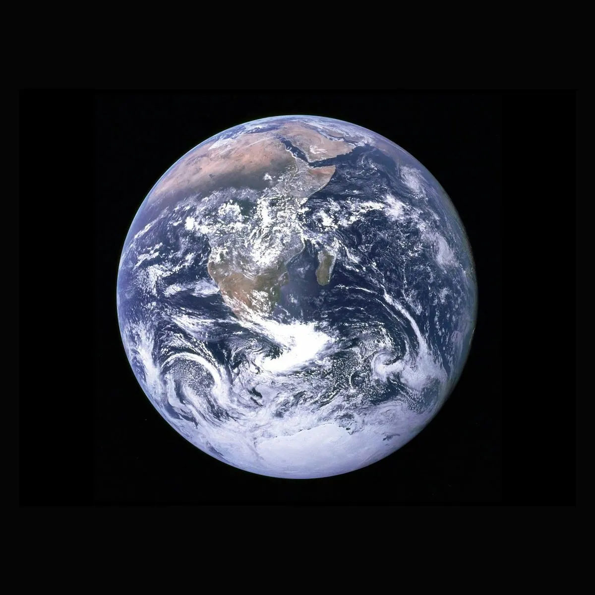 The Earth seen from space, with the commons.inc mark set around it