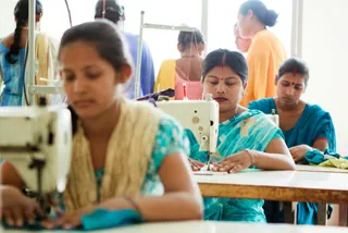 Women at sewing machines in a training room