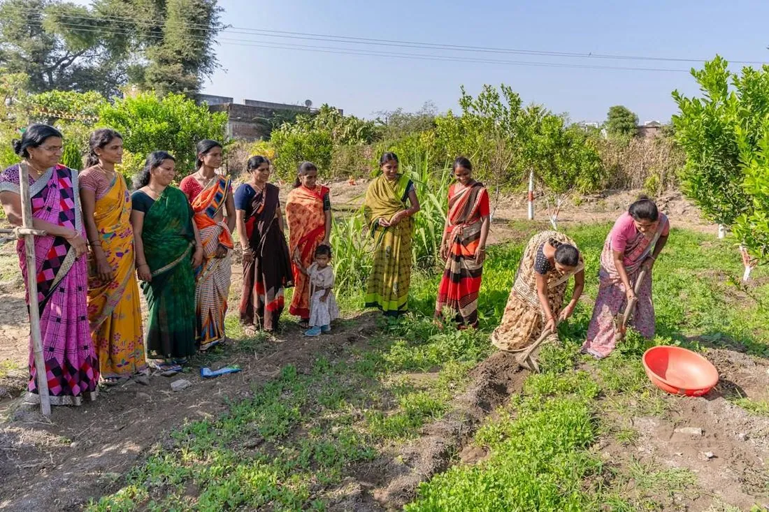 Women standing together in a field