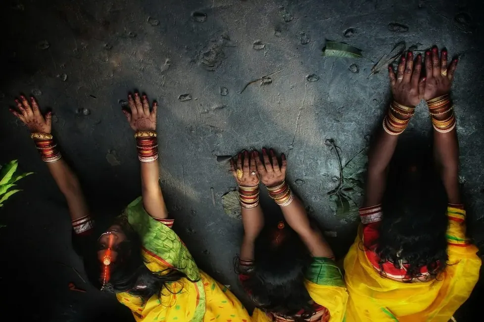 A group of young people in colourful clothes