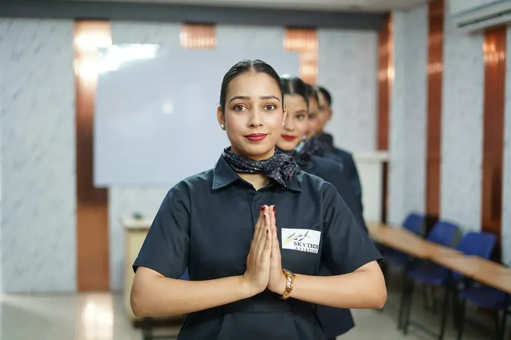 A woman in uniform greeting with palms together