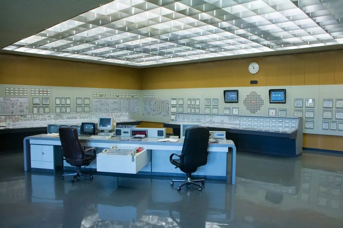 An empty control room of consoles