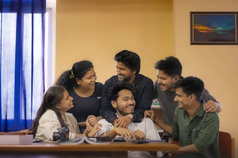 A group of young people sitting together