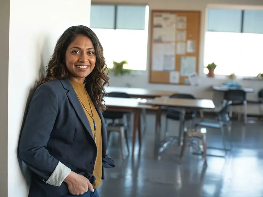 A woman standing in a meeting room