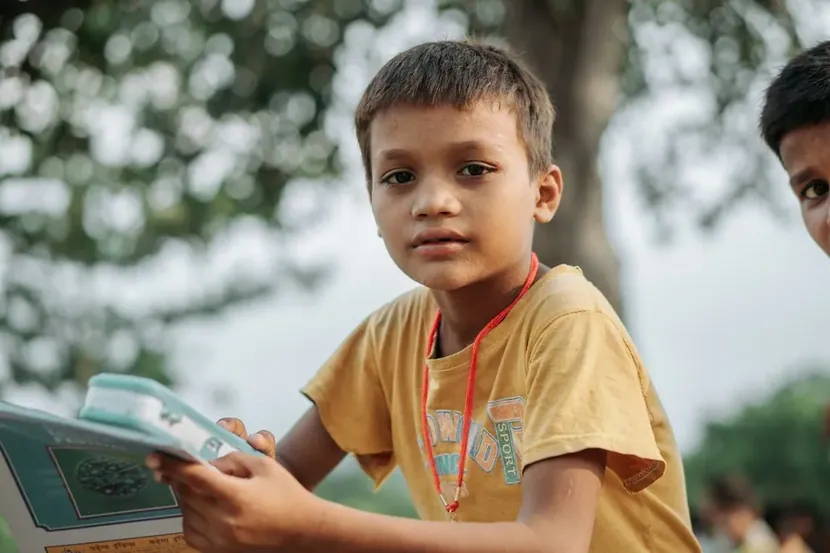 A boy holding a book