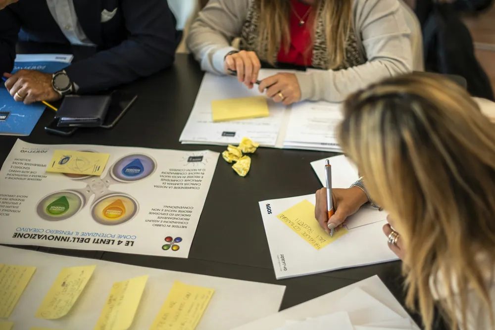 A planning session over printed charts