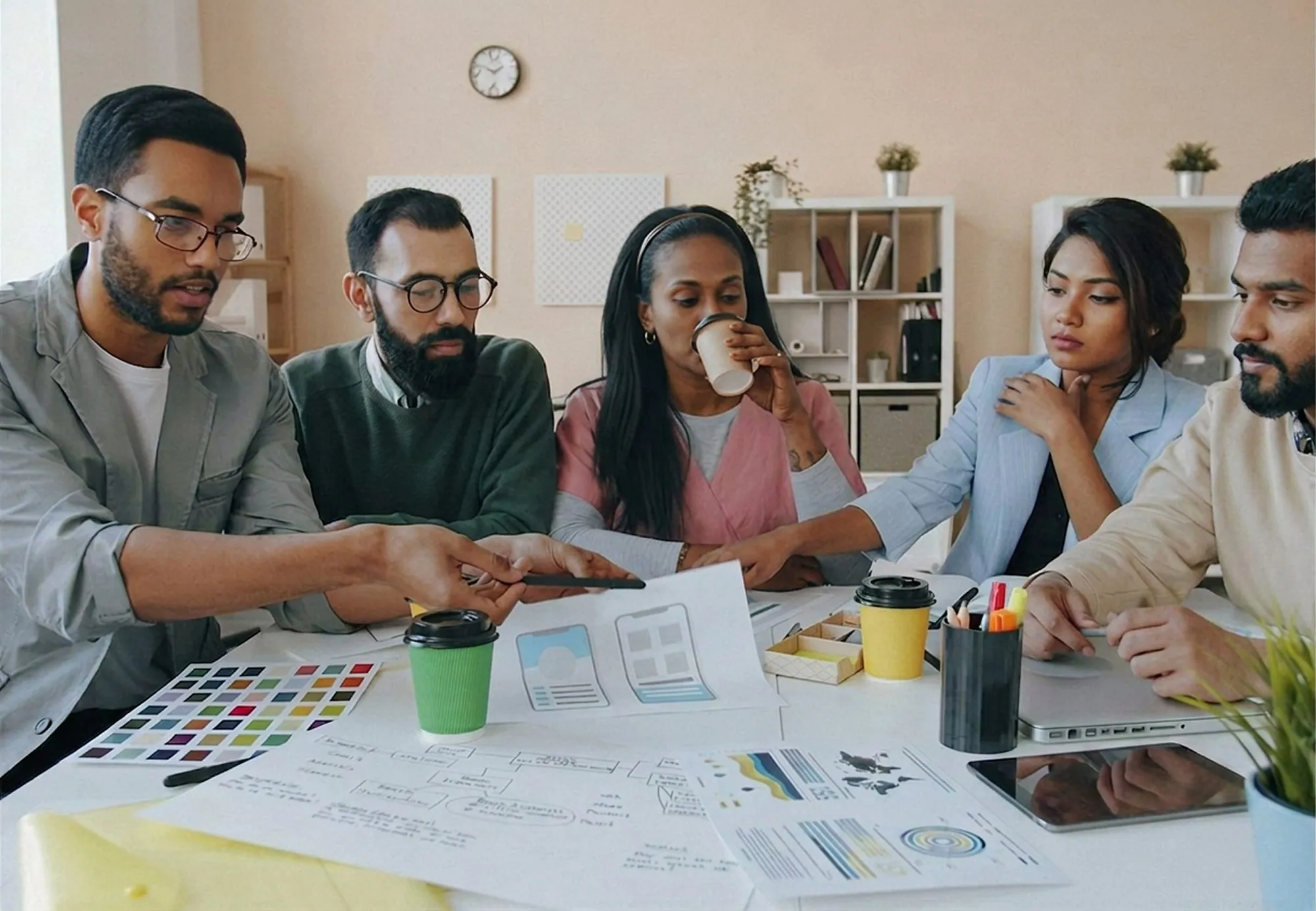 A design team at a table with colour charts