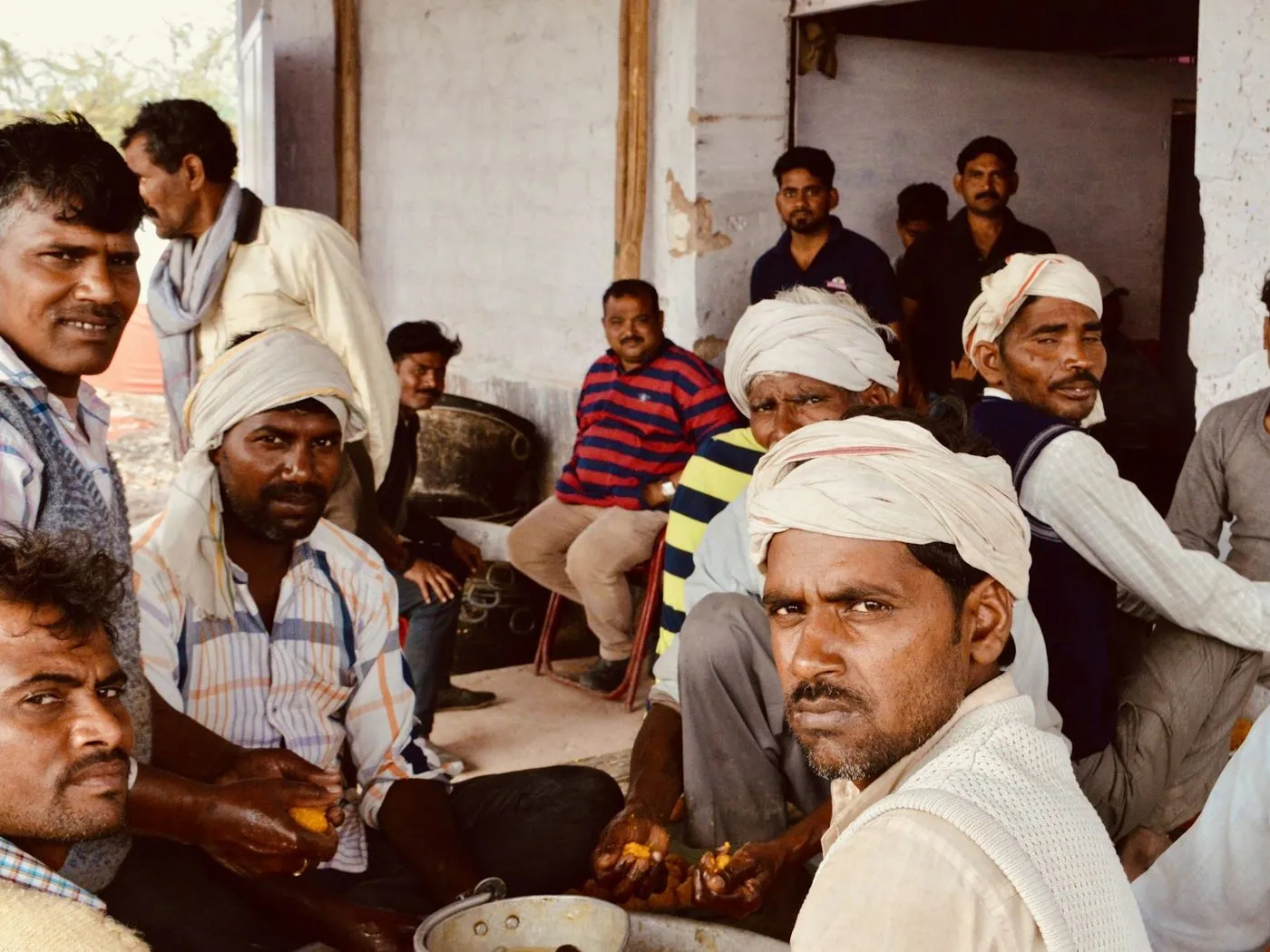 A crowd of farmers at a meeting