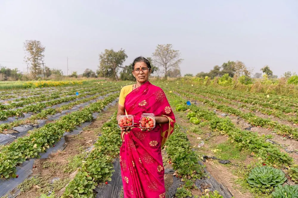 A woman standing in her vegetable plot